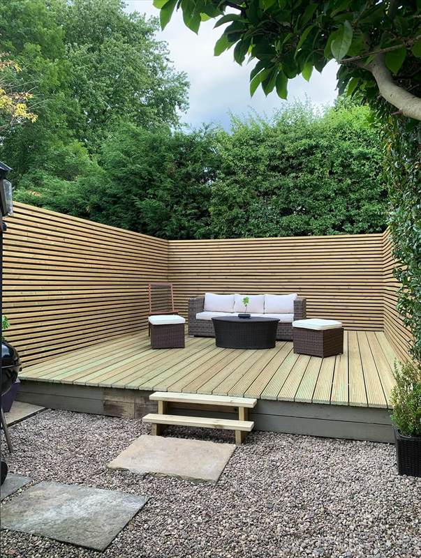 Timber garden decking with slatted privacy screening