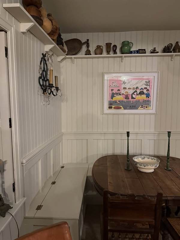 Panelled dining nook with built-in bench seating in a converted pub